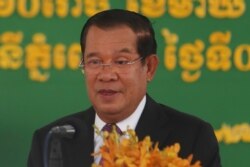 FILE - Cambodian Prime Minister Hun Sen delivers a speech at Phnom Penh International Airport, in Phnom Penh, Cambodia, Feb. 7, 2021.