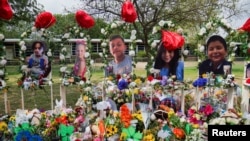 Flowers, toys, and other objects to remember the victims of the deadliest U.S. school mass shooting in nearly a decade, resulting in the death of 19 children and two teachers, are pictured at the Robb Elementary School in Uvalde, Texas, May 30, 2022. 