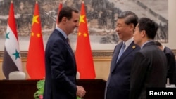 资料照：中国领导人习近平在杭州会晤到访的叙利亚总统阿萨德。（2023年9月22日）