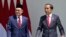 Indonesian President Joko Widodo, right, talks with Malaysian Prime Minister Anwar Ibrahim during their meeting at the presidential palace in Bogor, West Java, Indonesia, Monday, Jan. 9, 2023. (AP Photo/Achmad Ibrahim)