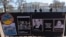 FILE - Signs and pictures of those killed, including journalist Brent Renaud, are displayed on a fence during a protest against Russia's invasion of Ukraine in Lafayette Park near the White House, March 13, 2022, in Washington. 