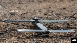 FILE - This image provided by the U.S. Marine Corps, shows a Switchblade drone system being used as part of a training exercise at Marine Corps Air Ground Combat Center Twentynine Palms, California, Sept. 24, 2021.
