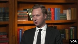Andrew Adams, director of the Justice Department's Task Force Kleptocapture, is seen in this screenshot from an interview with VOA in December 2022. 