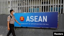 FILE - A security officer walks past the Association of Southeast Asian Nations (ASEAN) sign as he guards outside its secretariat building in Jakarta, Indonesia, Oct. 27, 2022.