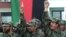 FILE - Afghan soldiers shout "Allahu akbar" (God is great) during their graduation ceremony in Kabul, March 27, 2003. 