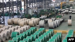 FILE - Steel rolls are seen at a holding area at a factory in Nantong in China's eastern Jiangsu province on March 1, 2022. 