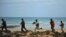 Somali security forces patrol along the coast of Qaw, in Puntland, northeastern Somalia, Dec. 18, 2016.