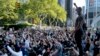 A group of protesters take a knee while marching in lower Manhattan, June 6, 2020, in New York