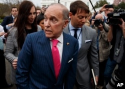 White House chief economic adviser Larry Kudlow talks with reporters outside the White House, April 4, 2018, in Washington.