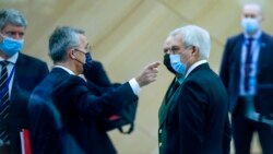 NATO Secretary General Jens Stoltenberg, second left, speaks with Russia's Deputy Foreign Minister Alexander Grushko, center right, and Russia's Deputy Defense Minister Alexander Fomin, center left, at NATO headquarters, in Brussels, Jan. 12, 2022.