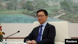 FILE - Chinese Vice President Han Zheng attends a meeting with Britain's Chancellor of the Exchequer Rachel Reeves (not pictured) at the Great Hall of the People in Beijing, Jan. 11, 2025.