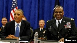 时任美军中央司令部司令的奥斯汀将军与时任总统奥巴马出席一场活动（路透社2014年9月17日）