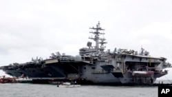 The U.S. aircraft carrier USS Ronald Reagan is anchored off Manila Bay, Philippine, for a port call Wednesday, Aug. 7, 2019. The USS Ronald Reagan is cruising in international waters in the South China Sea amid tensions in the disputed islands,…