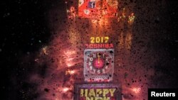 Fireworks and confetti mark the new year in Times Square in New York, U.S. Jan. 1, 2017.