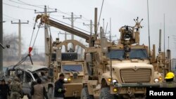 A suicide car bomber killed three members of the U.S.-led coalition in Afghanistan in an explosion in Kabul.