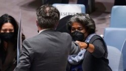 Ukraine's United Nations Ambassador Sergiy Kyslytsya, center, fist-bumps U.S. Ambassador Linda Thomas-Greenfield, left, after a Security Council meeting at U.N. headquarters, Jan. 31, 2022.