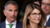 FILE - In this April 3, 2019, photo, actress Lori Loughlin, front, and her husband, clothing designer Mossimo Giannulli, left, depart federal court in Boston after a hearing in a nationwide college admissions bribery scandal.