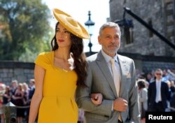 Amal Clooney dan George Clooney saat menghadiri pernikahan Pangeran Harry dan Meghan Markle di Kapel St George's Chapel di Kastil Windsor, 19 Mei 2018.