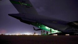 FILE - In this Aug. 30, 2021, photo provided by the U.S. Air Force, an Air Force aircrew prepares to receive soldiers to board an aircraft amid evacuation operation missions at Hamid Karzai International Airport in Kabul, Afghanistan.