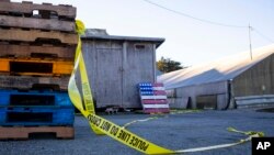Police tape marks off the scene of a shooting off Cabrillo Highway, Jan. 24, 2023, after a gunman killed several people at two agricultural businesses in Half Moon Bay, California. 