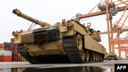 FILE - A U.S. M1A2 Abrams battle tank is unloaded at the Baltic Container Terminal in Gdynia, Poland, Dec. 3, 2022. Taiwan has received a customized version of the tank for its military known as the M1A2T