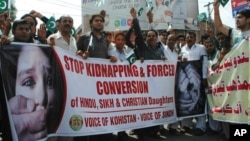 FILE - Pakistani civil society activists rally for protection of Hindu girls at a protest in Hyderabad, Pakistan, July 4, 2019. 