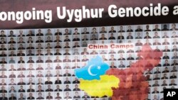 A sign is displayed as the East Turkistan Awakening Movement holds a rally outside the White House against the Chinese Communist Party to coincide with the 73rd National Day of the People's Republic of China in Washington, Oct. 1, 2022.