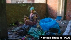 Omu Mina, a 42-year-old mother of four, says, “My husband is sick and unable to work long hours anymore. Now I sort trash after my work as a rug weaver to pay for our children’s schooling.”