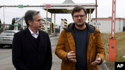 U.S. Secretary of State Antony Blinken, left, and Ukrainian Foreign Minister Dmytro Kuleba speak to the media at the Ukrainian-Polish border crossing in Korczowa, Poland, March 5, 2022.