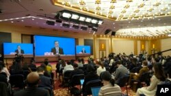 Chinese Foreign Minister Wang Yi speaks during a remote video press conference called Russia Beijing's "most important strategic partner," amid its continued refusal to condemn the invasion of Ukraine, in Beijing, March 7, 2022.