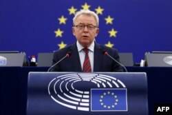 FILE - European Commissioner for Agriculture Janusz Wojciechowski speaks at the European Parliament in Strasbourg, France, Nov. 23, 2021.