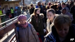 At first the foreign volunteers were Ukrainian expatriate men heading to fight and people delivering aid. But increasingly, women are also heading back.