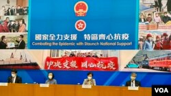 香港行政长官林郑月娥(右二)3月9日食物及卫生局局长陈肇(左二),香港行政长官,香港行政长官(左一),香港及福利局日报高级官方流行病记者。