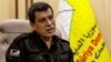 FILE - Syrian-Kurdish commander Mazloum Abdi of the U.S.-backed Syrian Democratic Forces speaks during a news conference in Hasakah, Syria, Nov. 26, 2022. 