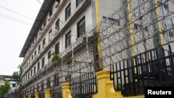 Barbed wire fences are seen outside a shuttered Great Wall Park compound where Cambodian authorities said they had recovered evidence of human trafficking, kidnapping and torture during raids on suspected cybercrime compounds in Sihanoukville, Cambodia, Sept 21, 2022.