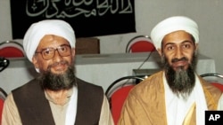 FILE - Osama bin Laden and chief aide Ayman al Zawahri (r-l), Khost, Afghanistan, in 1998.