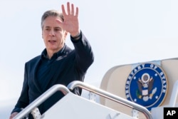 Secretary of State Antony Blinken boards his plane at Andrews Air Force Base, Md., Tuesday, Aug. 2, 2022. Blinken begins a ten day trip traveling to Cambodia, Philippians, South Africa, Congo, and Rwanda. (AP Photo/Andrew Harnik, Pool)