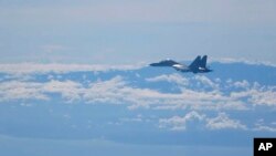 ARHIVA - Kineski vojni avion (Foto: Xinhua via AP)