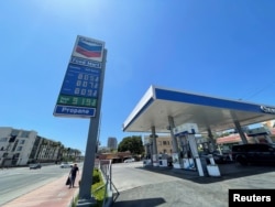 Gas prices over the $8.00 mark are advertised at a Chevron Station in Los Angeles, California, May 30, 2022.