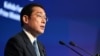 Japan's Prime Minister Fumio Kishida delivers the keynote address at the opening dinner of the 19th Shangri-La Dialogue in Singapore, June 10, 2022. 