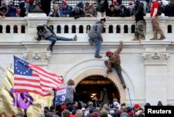 FILE - A mob of supporters of then U.S. President Donald Trump storm the U.S. Capitol building in Washington, Jan. 6, 2021.
