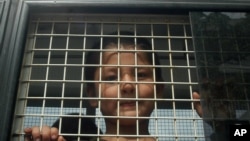 泰国警车里一名维吾尔男孩。（资料照)