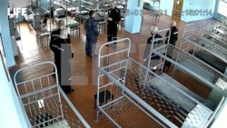 FILE - A still image from CCTV footage published by Life.Ru shows what is said to be Alexey Navalny speaking with a prison guard at the IK-2 corrective penal colony in the town of Pokrov, Russia, in this image released Apr. 2, 2021.