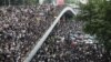 Protesters march along a road demonstrating against a proposed extradition bill in Hong Kong, China, June 12, 2019. 