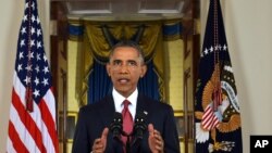 FILE - President Barack Obama addresses the nation from the Cross Hall in the White House in Washington, Sept. 10, 2014.