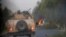 FILE - Humvees that belong to Afghan Special Forces are seen destroyed during heavy clashes with Taliban, in Kandahar province, Afghanistan, July 13, 2021. 
