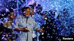 Indonesian presidential candidate Prabowo Subianto dances as he claims victory during an event to watch the results of the general election in Jakarta on Feb. 14, 2024. Unofficial counts showed Subianto with 60% of the vote.