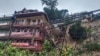 Sebuah rumah yang rusak akibat longsor yang disebabkan banjir bandang di Mandi, Himachal Pradesh, India, Senin, 14 Agustus 2023. (Foto Subhas Dogra via Reuters)
