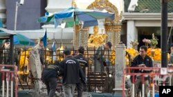 Police investigate a scene the morning after an explosion in Bangkok,Thailand, Tuesday, Aug. 18, 2015. 
