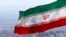 FILE - Iran's national flag waves in Tehran, Iran, March 31, 2020. Iran's highest court has overturned the death sentence of a woman labor rights activist, local media reported Saturday. 